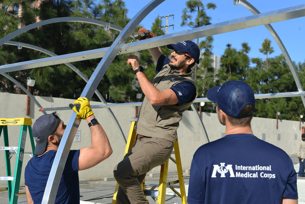International Medical Corps staff members set up an emergency shelters at the University of Southern California (USC) Medical Center in Los Angeles, CA, on March 30, 2020.
