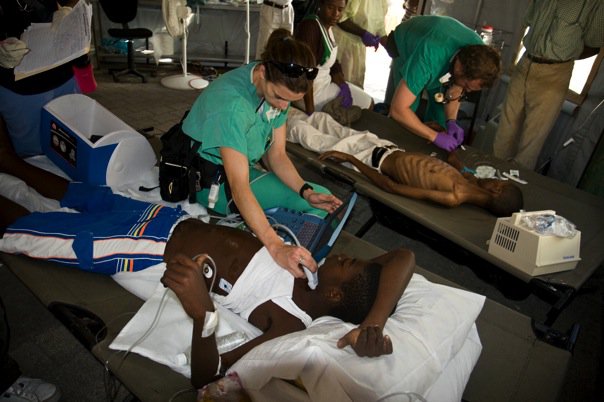 Emilie performing an ultrasound in Haiti after the 2010 earthquake
