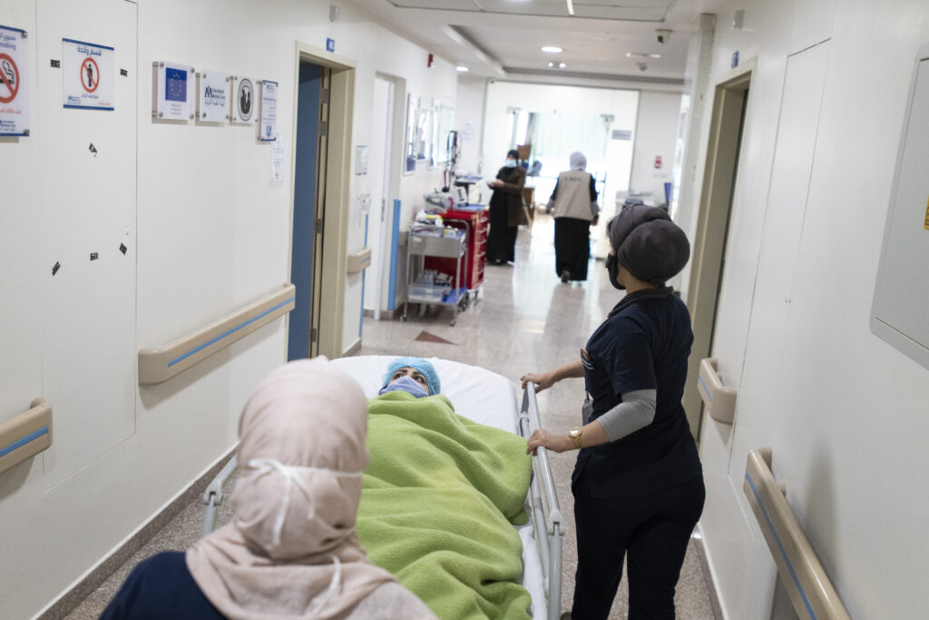 International Medical Corps nurses take a patient (Faiza Fawaz Ayash) to the operating room for a C-section, in the International Medical Corps Maternity ward, Irbid Specialty Hospital, Irbid, Jordan.
