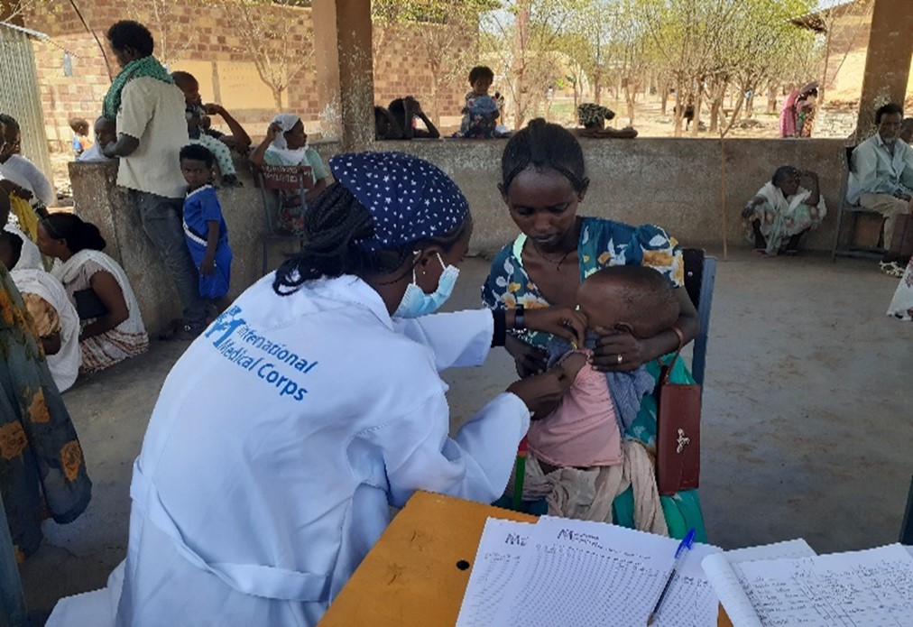 International Medical Corps staff members screen children for acute malnutrition at the 107 Core Elementary School IDP site, Ethiopia.