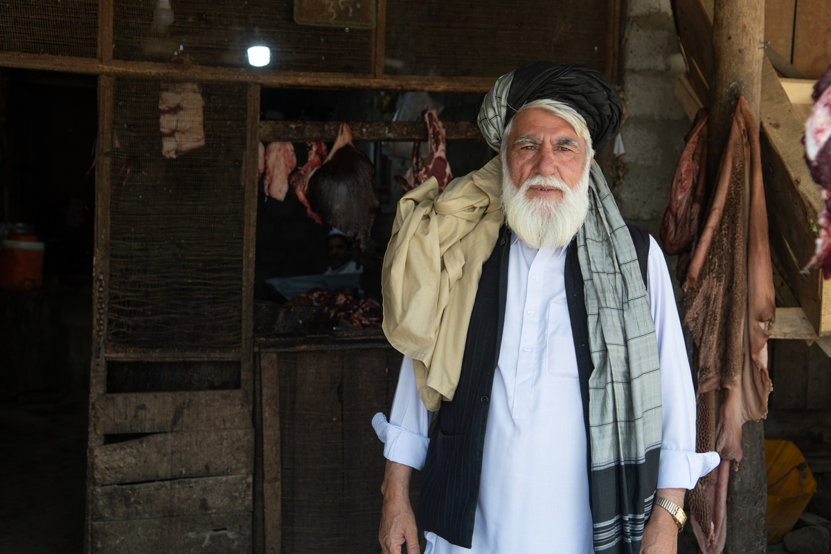 Musa Khan, a community elder and owner of a meat shop, always participates in awareness activities led by International Medical Corps. 
