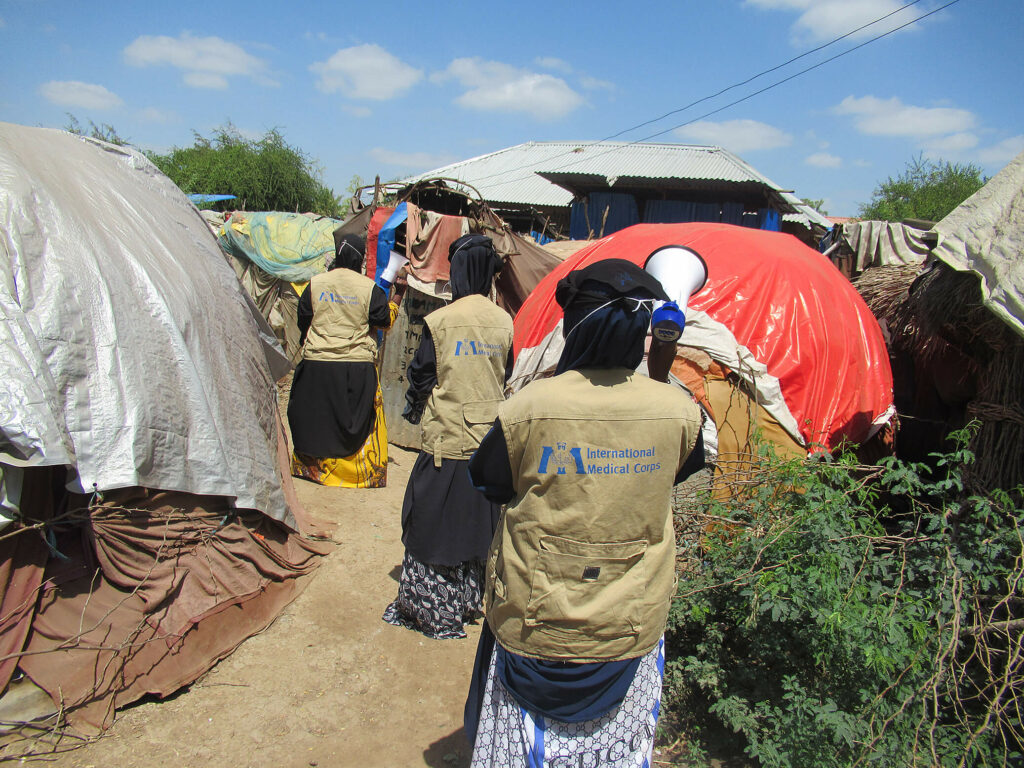 Female health workers spread awareness and educate the community about COVID-19 in an IDP camp in Somalia.