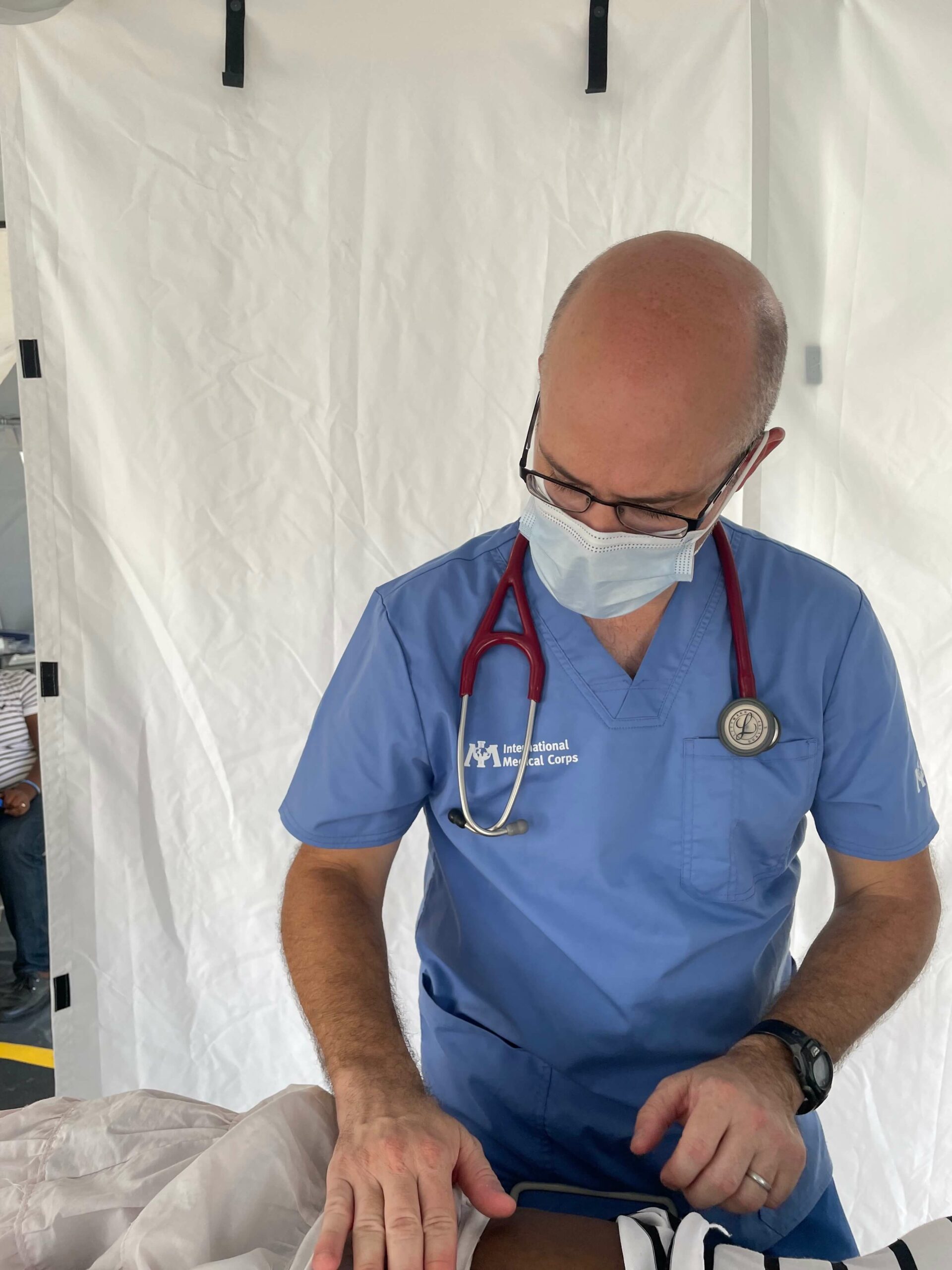 Dr. Chad Knaus examines a Haitian patient.