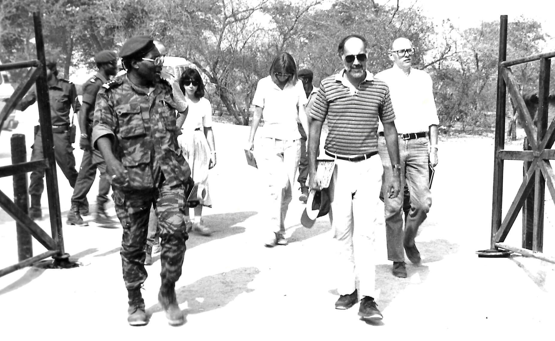 The Angola assessment team in Jamba, walking with Jonas Savimbi’s chief of staff toward the underground bunker office where they would meet with Savimbi. Garvelink is to the far right and Aossey is to the far left.