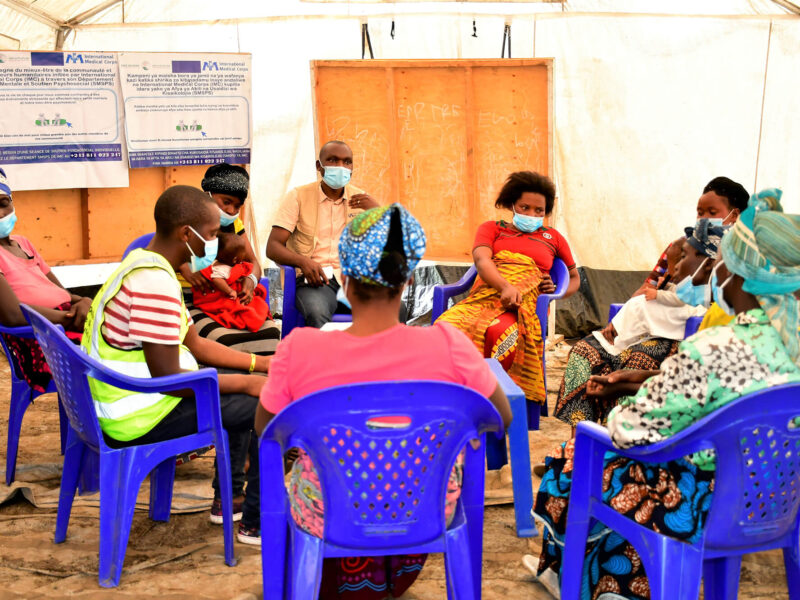 International Medical Corps staff and volunteers lead a psychosocial support group session for residents of Mujoga camp after the 2021 eruption of Mount Nyiragongo near Goma, a town in the Democratic Republic of the Congo.