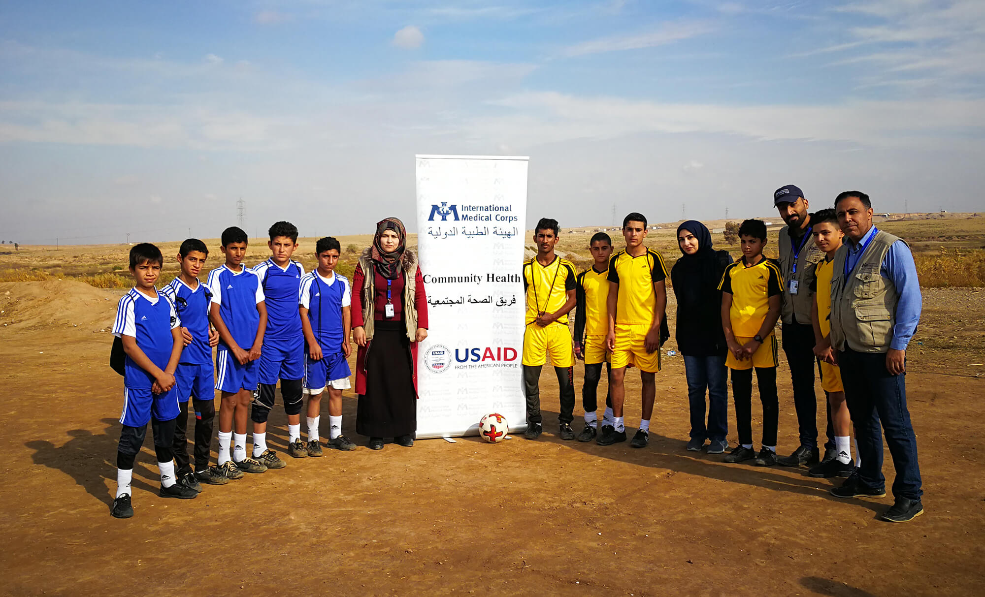Hamsa Mohammed attends a sporting event in Khazir camp to raise awareness of community health.