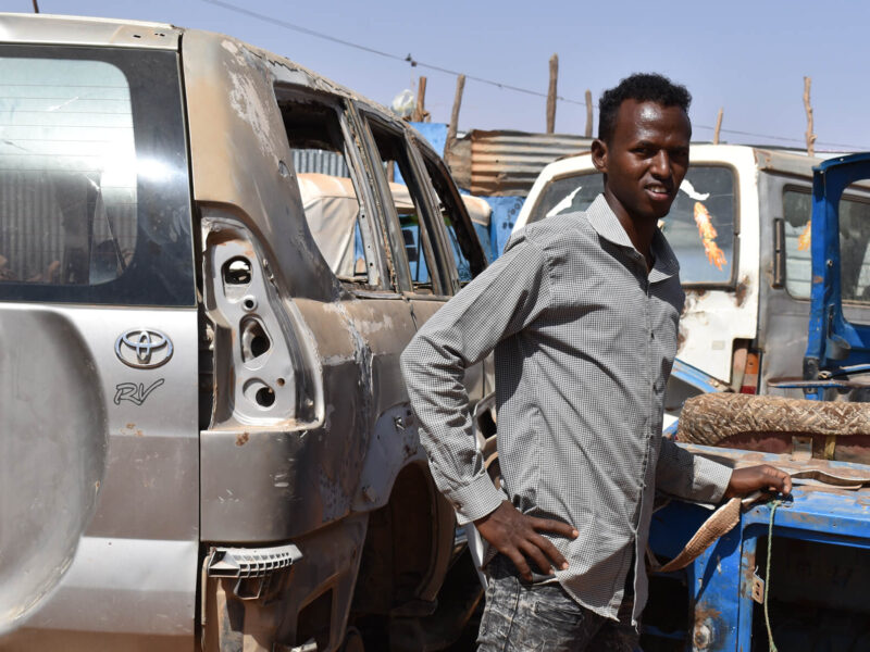 Nasteeh Mohamed Omer, who participated in International Medical Corps’ Addressing Root Causes of Migration (ARC) program, works at a garage in Dollo Ado, Ethiopia, after his auto mechanics training.