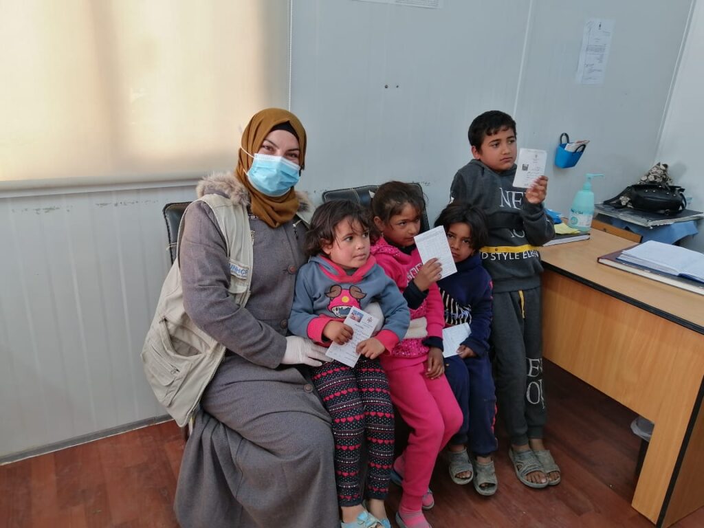 The community health volunteers accompanied the family to the vaccination facility at the primary healthcare clinic, where the children received their immunizations.