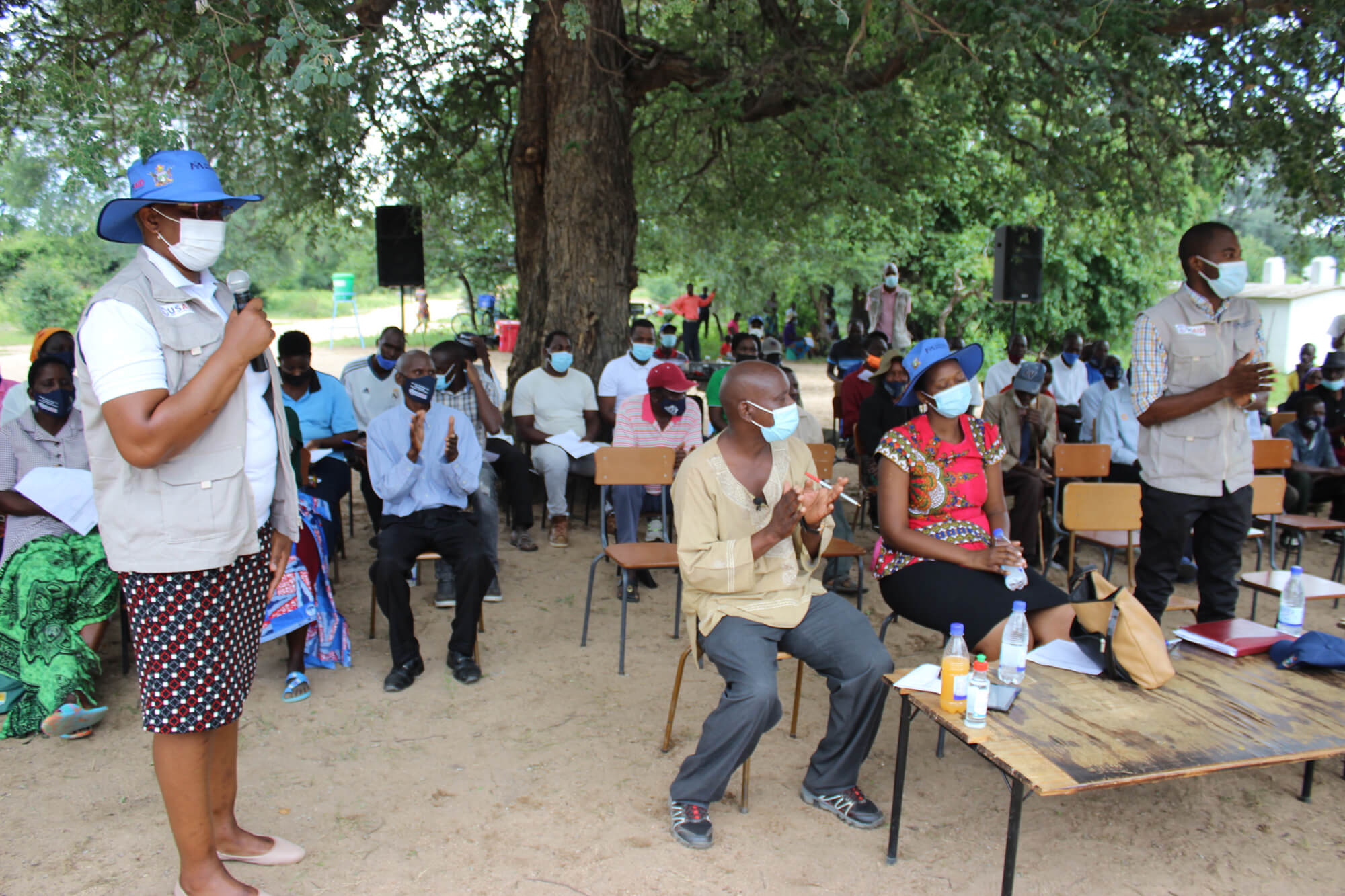 International Medical Corps staff and stakeholders watch the World Water Day events.