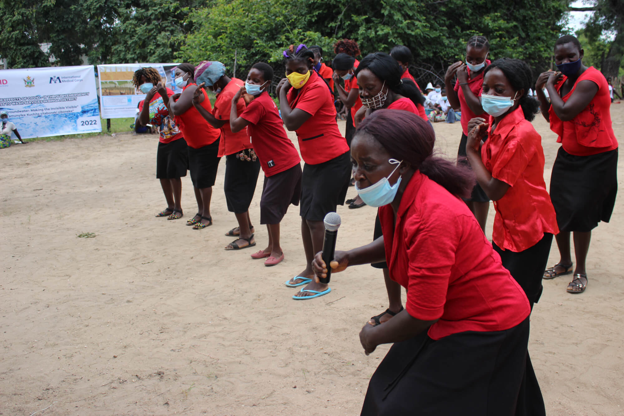 Members of the Tumvwanane community health club, from Siangwemu village, sing and perform during World Water Day.