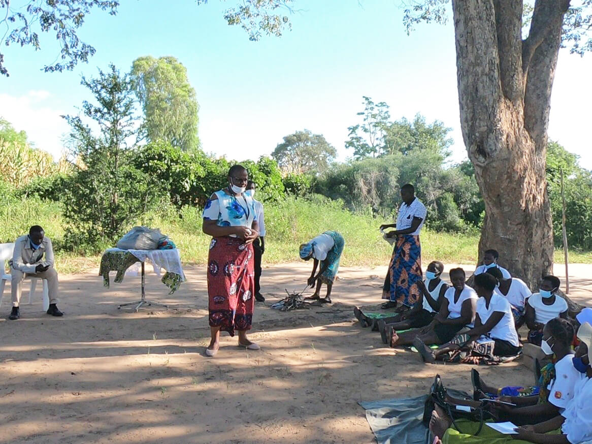 A WASH officer addresses members of community health clubs in Damba village in Binga, Zimbabwe, during a health and hygiene training session.