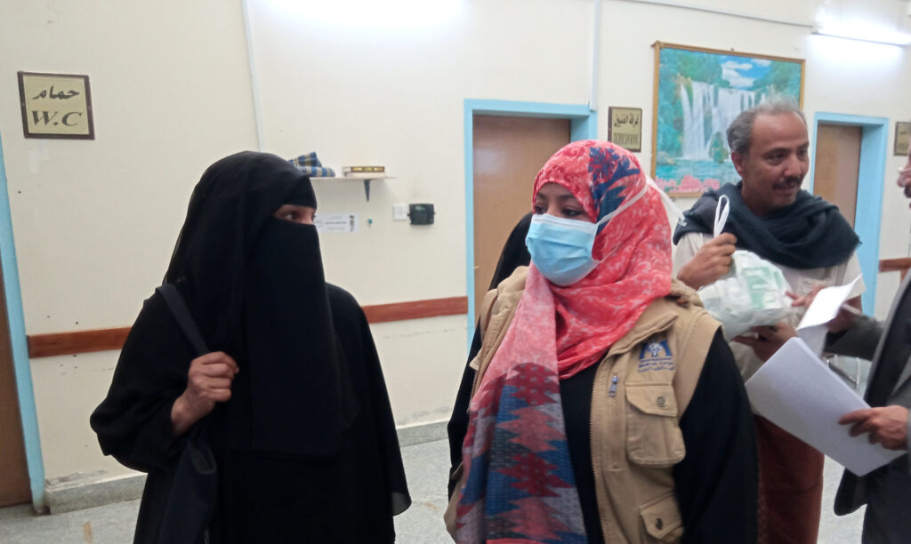 International Medical Corps Programs Manager Nebras Khaled talks with aa former breast cancer patient who was discharged earlier this year as cured following her treatment at the NOC.