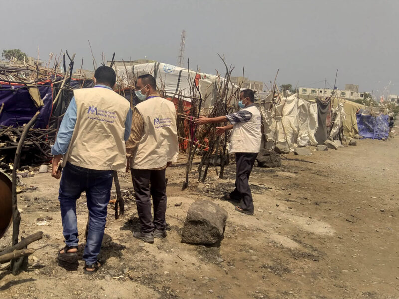 An International Medical Corps mobile team surveys damage to a family tent gutted by fire at the Al Qahera displacement camp.