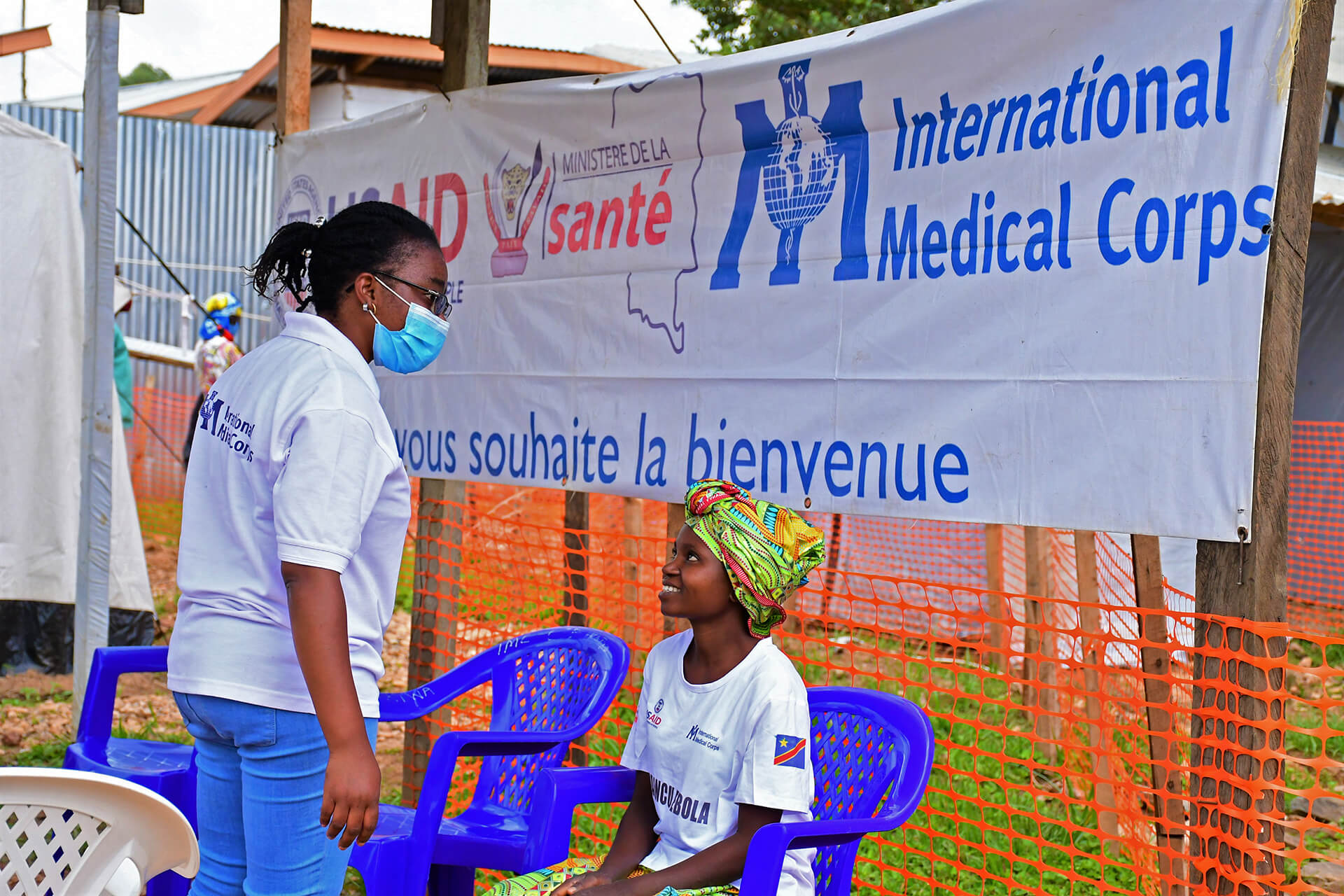 Dr. Lina Kashibura talks with an Ebola survivor before her release from the Ebola treatment center in North Kivu.