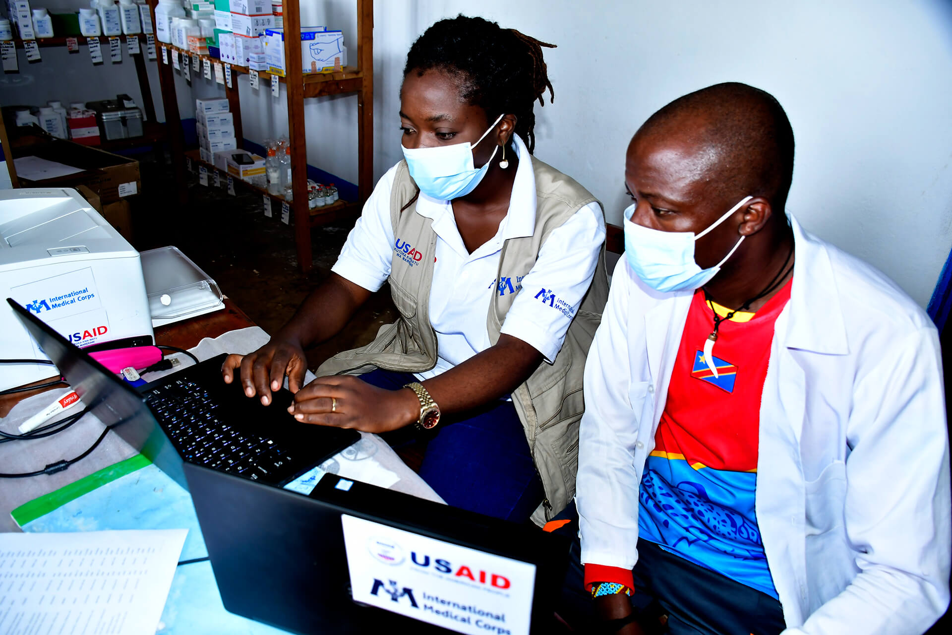 Rosine Ishara, an International Medical Corps pharmacist in Uvira, trains a pharmacist in one of our partner health centers.