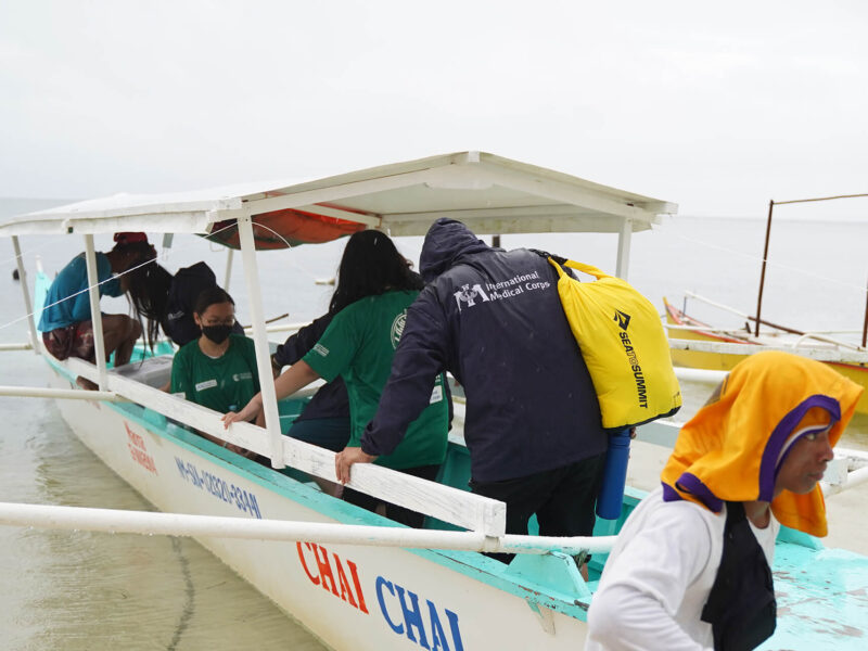 Staff members load the boat at Halian Island to return to Siargao Island.