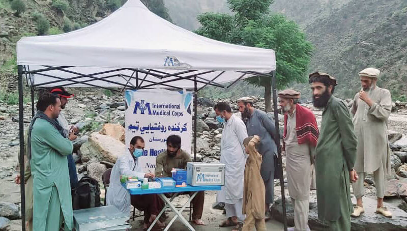 A mobile team provides primary healthcare services after a flash flood in Kamdish, Nuristan.