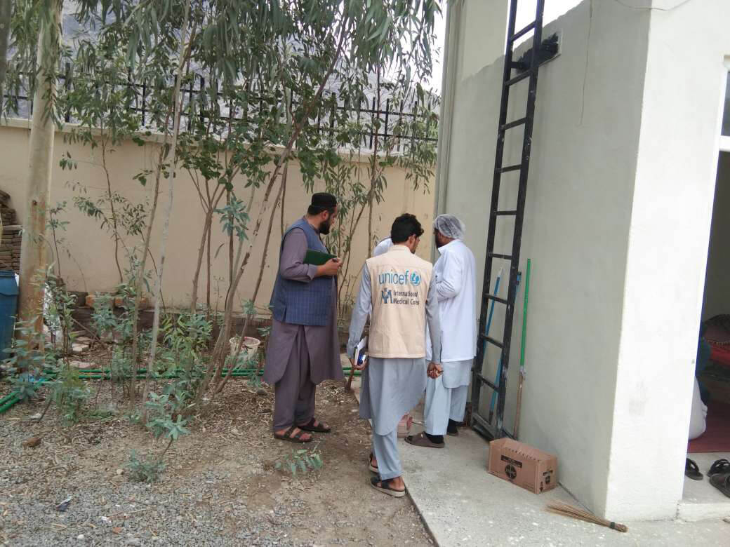International Medical Corps staff members conduct a field visit at Torkham Health Facility in Afghanistan.