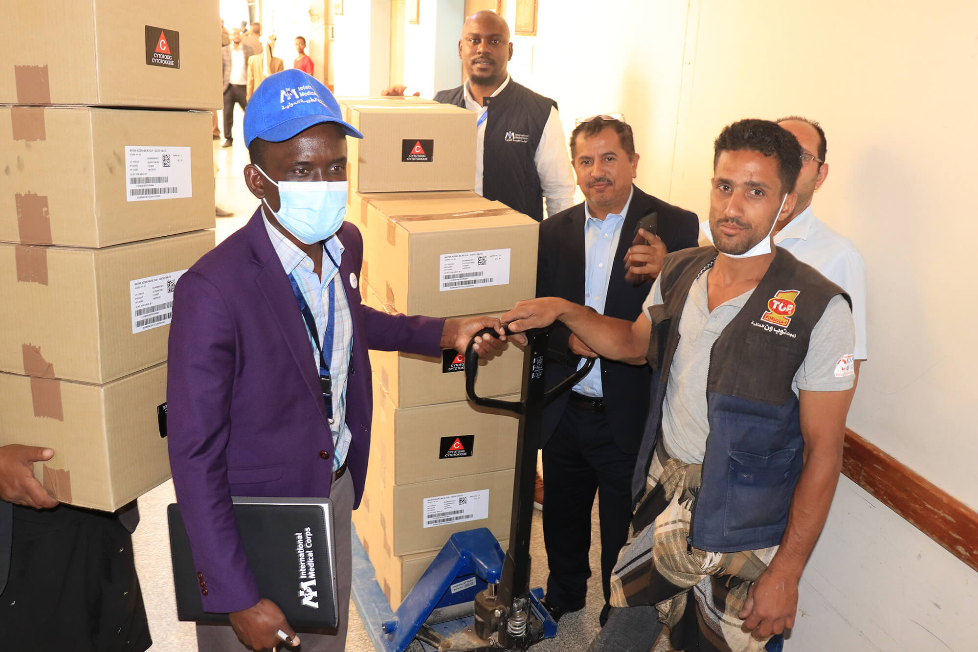 Members of our Health Program team take delivery of the valuable cancer drugs at the National Oncology Center in Sana’a.