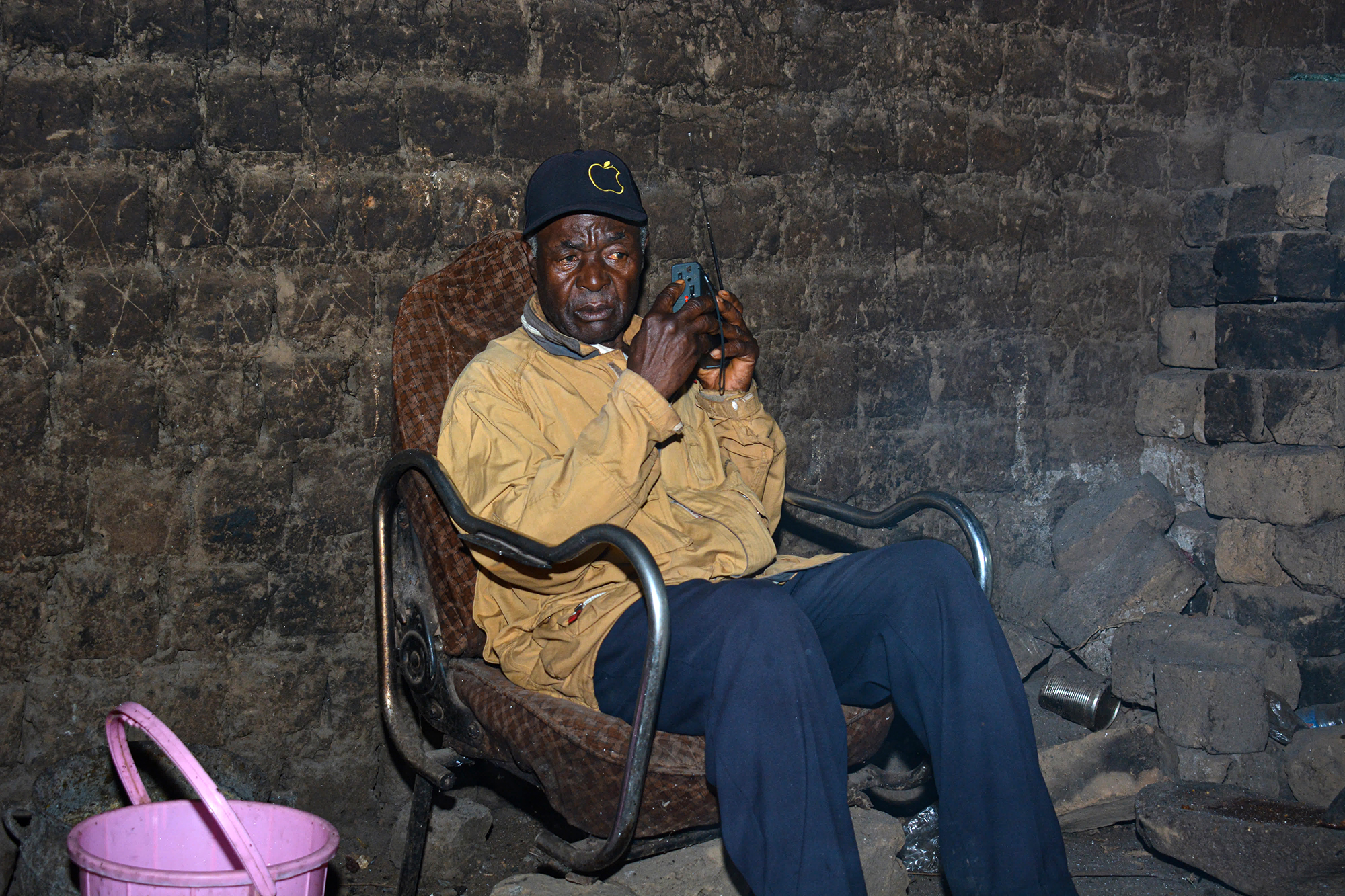 Isaac Teboh waits at home with his radio.