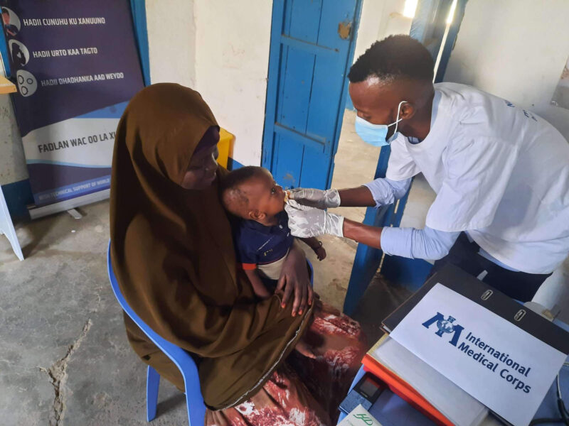 Ruqiyo Haji holds her daughter, Halimo, during a medical checkup and consultation at the Kulmis Health and Nutrition Facility in Jowhar.