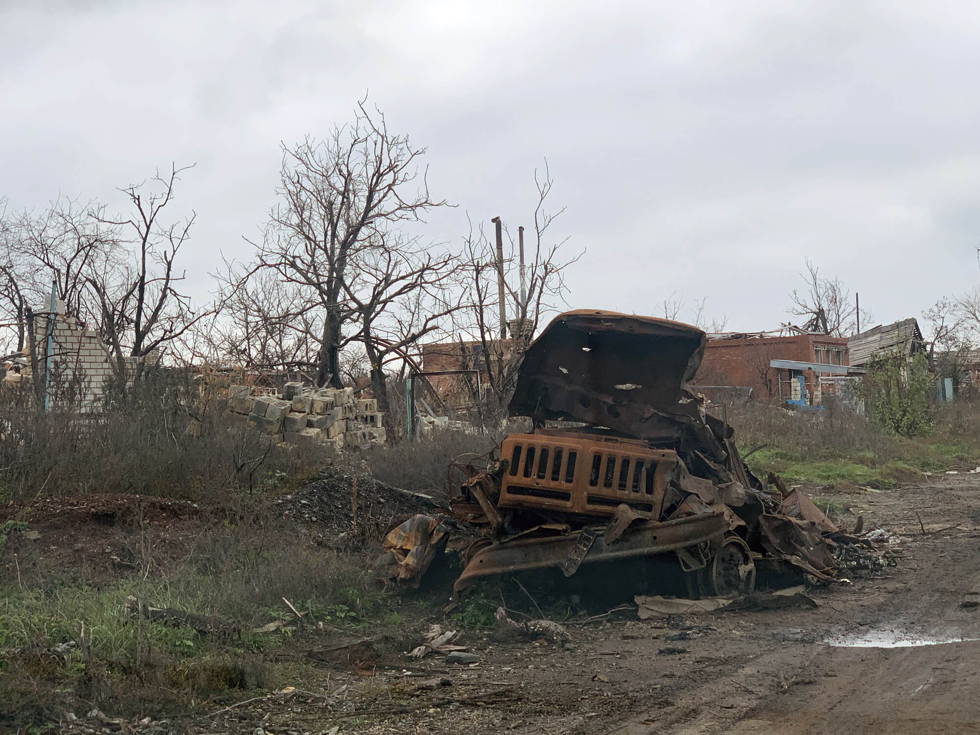 Roads that were once lined with trees in Dovgenke village now contain the remains of military trucks destroyed in battle.