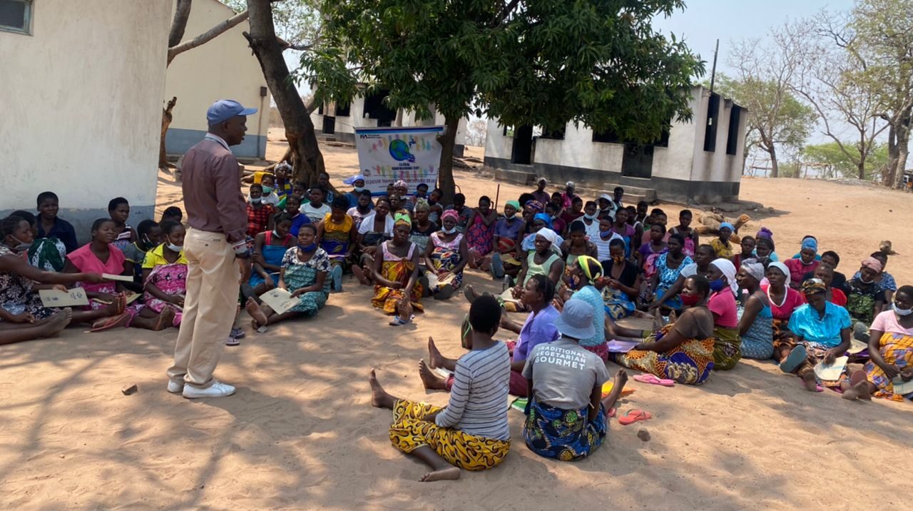 A Ministry of Health District Nutrition Assistant conducts a health education session at Binga Waiting Home.