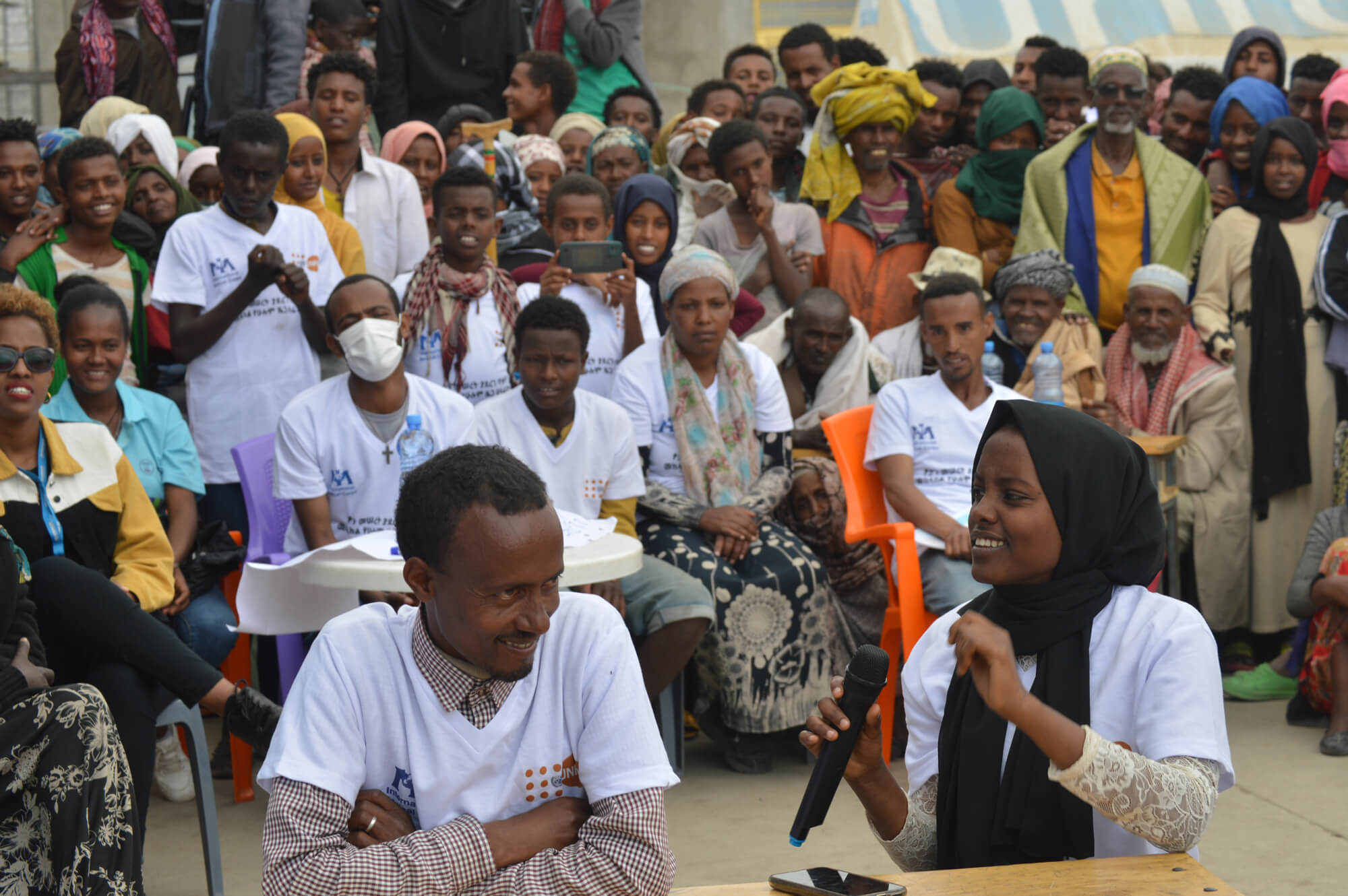 Rehmet Seid (right), an IDP at the China site in Debere Berhan, Ethiopia, answers questions during the quiz competition.