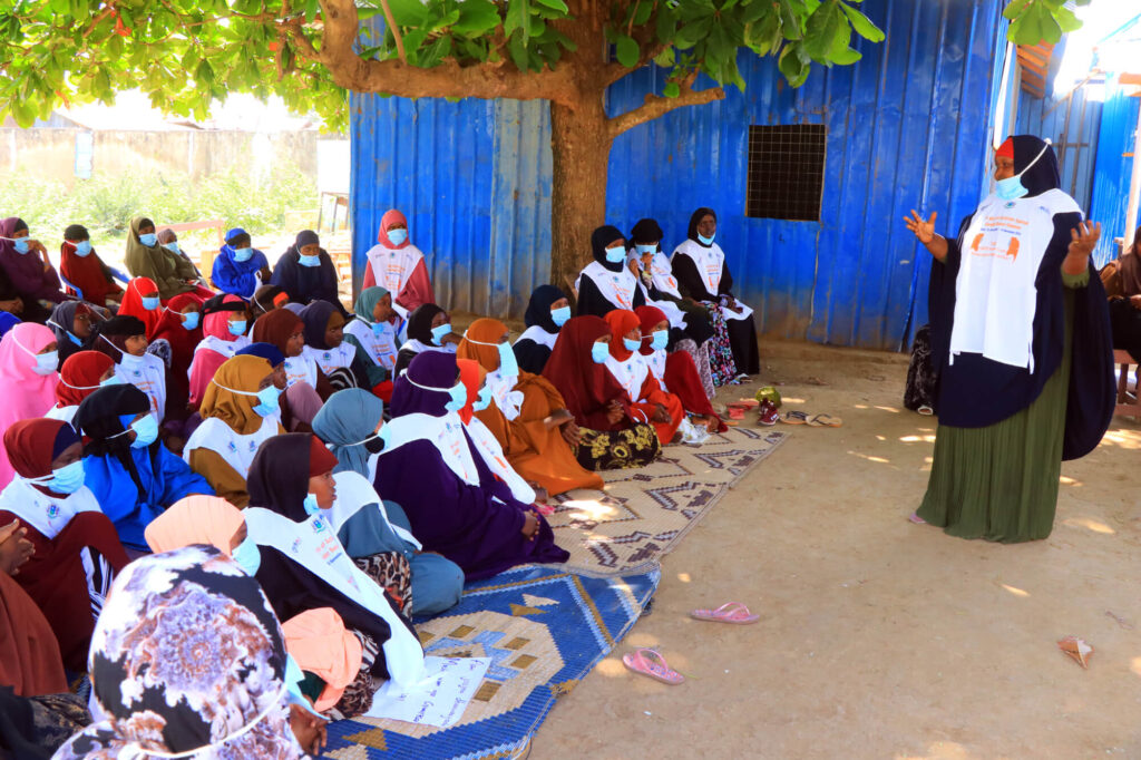 District Women’s Association representative Fahma Adow Mahamed speaks to women in Jowhar, Somalia, encouraging them to advocate for their own rights and help stop GBV.
