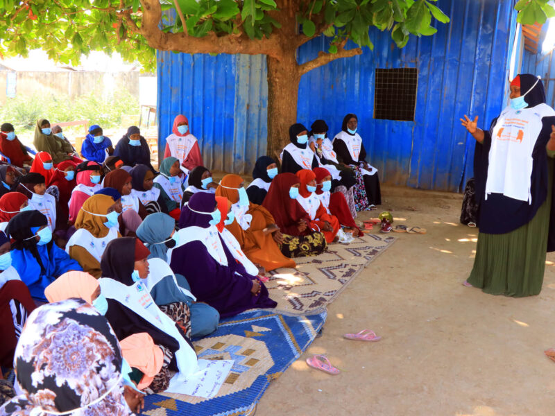 District Women’s Association representative Fahma Adow Mahamed speaks to women in Jowhar, Somalia, encouraging them to advocate for their own rights and help stop GBV.