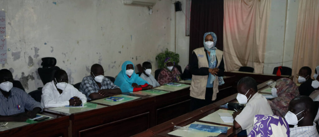 Rania Mohammed Abdalrahman Mohammed leads an infection prevention control training for clinic staff in Ad-Damazin, Sudan.