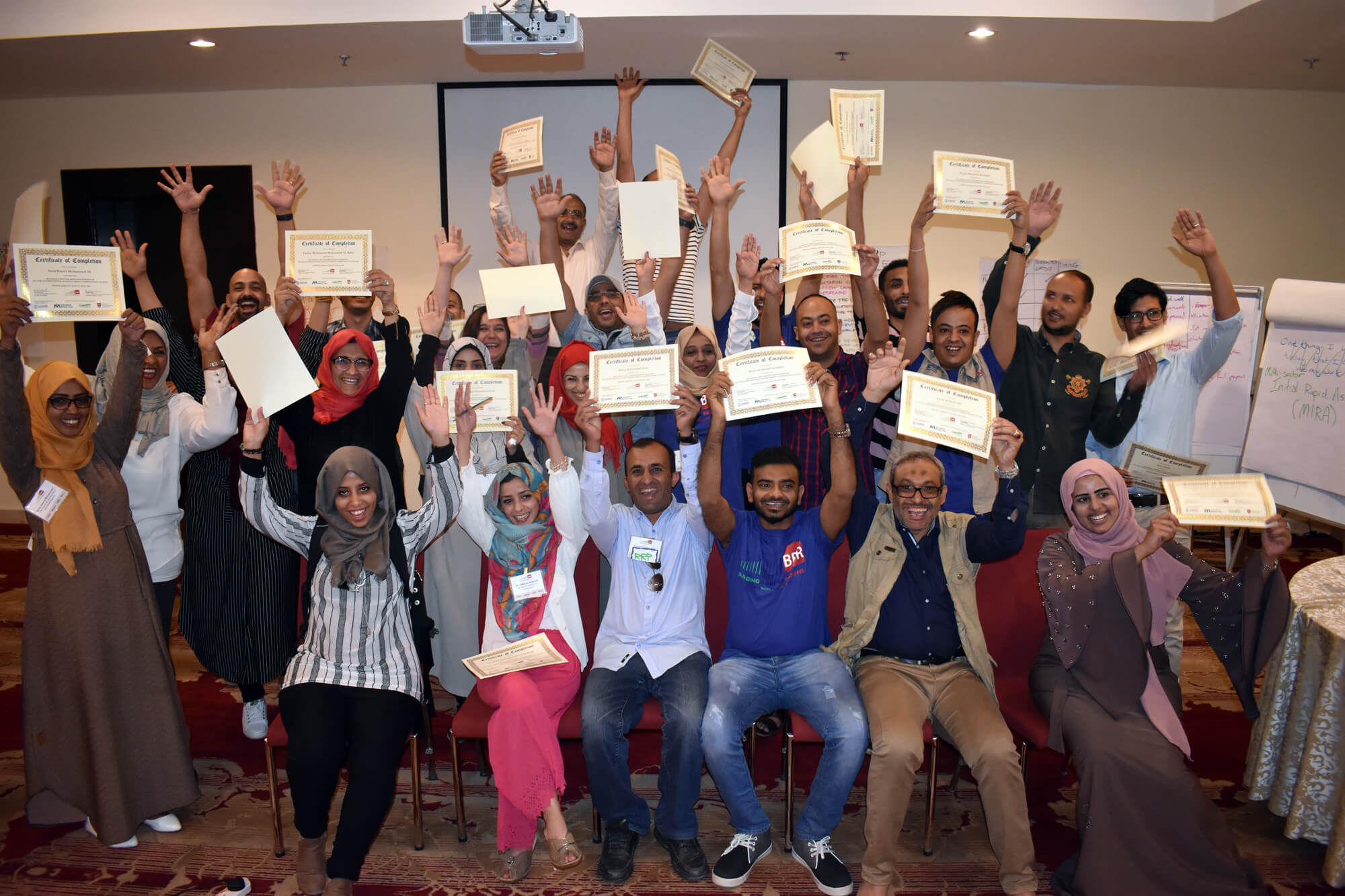 Participants at a BBR workshop in Jordan receive their certificates of completion on the meeting’s final day.
