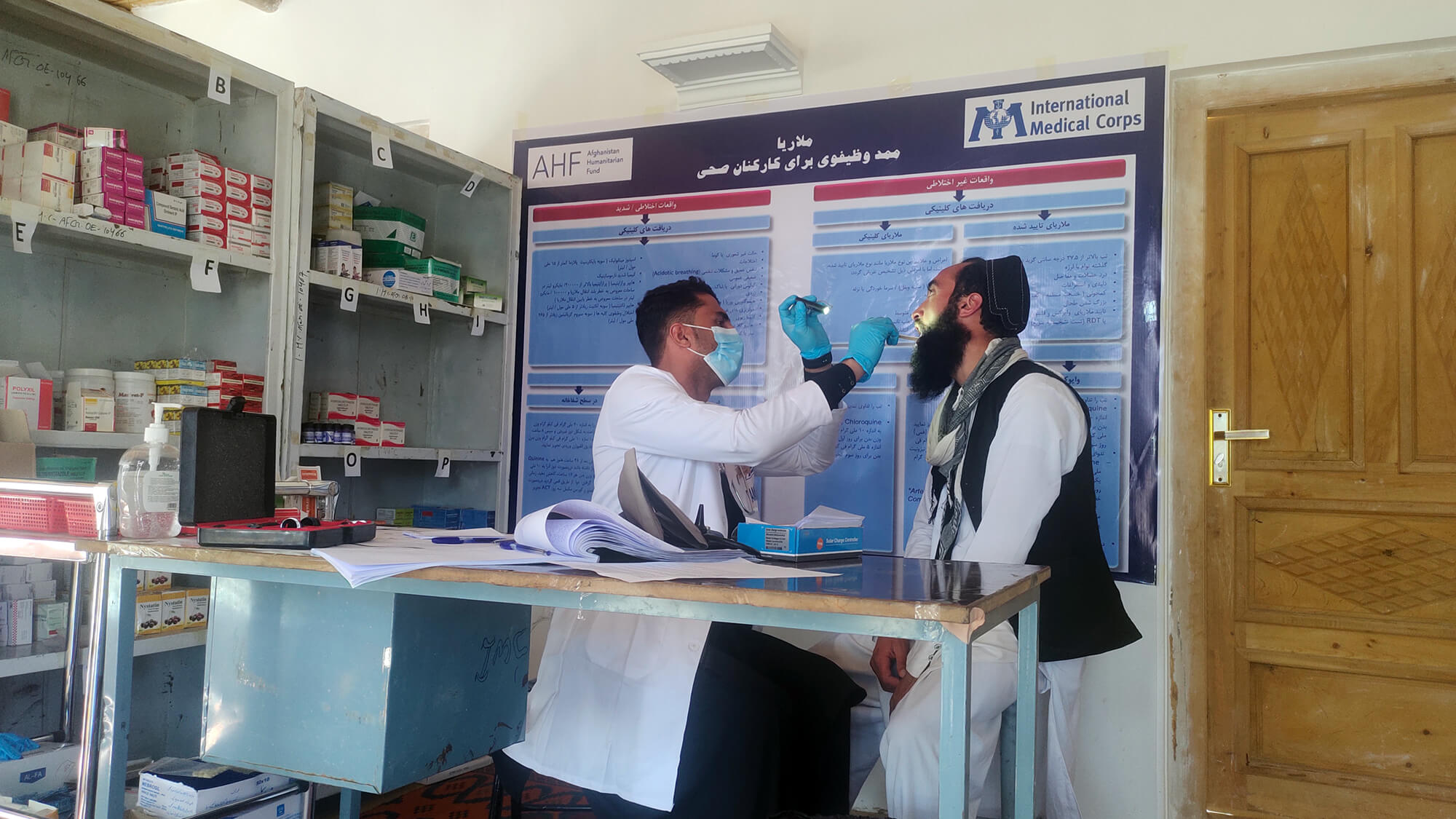 An International Medical Corps doctor examines a patient at the health clinic in Zeruk district.
