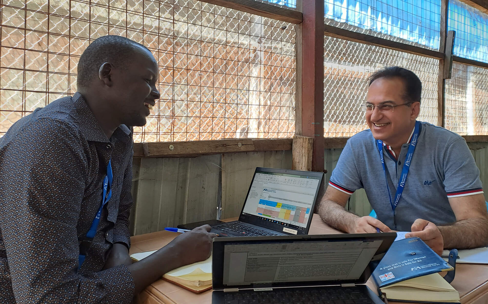 Dr. Bhisham Kotak conducts a progress review and planning meeting with a health manager in Malakal.