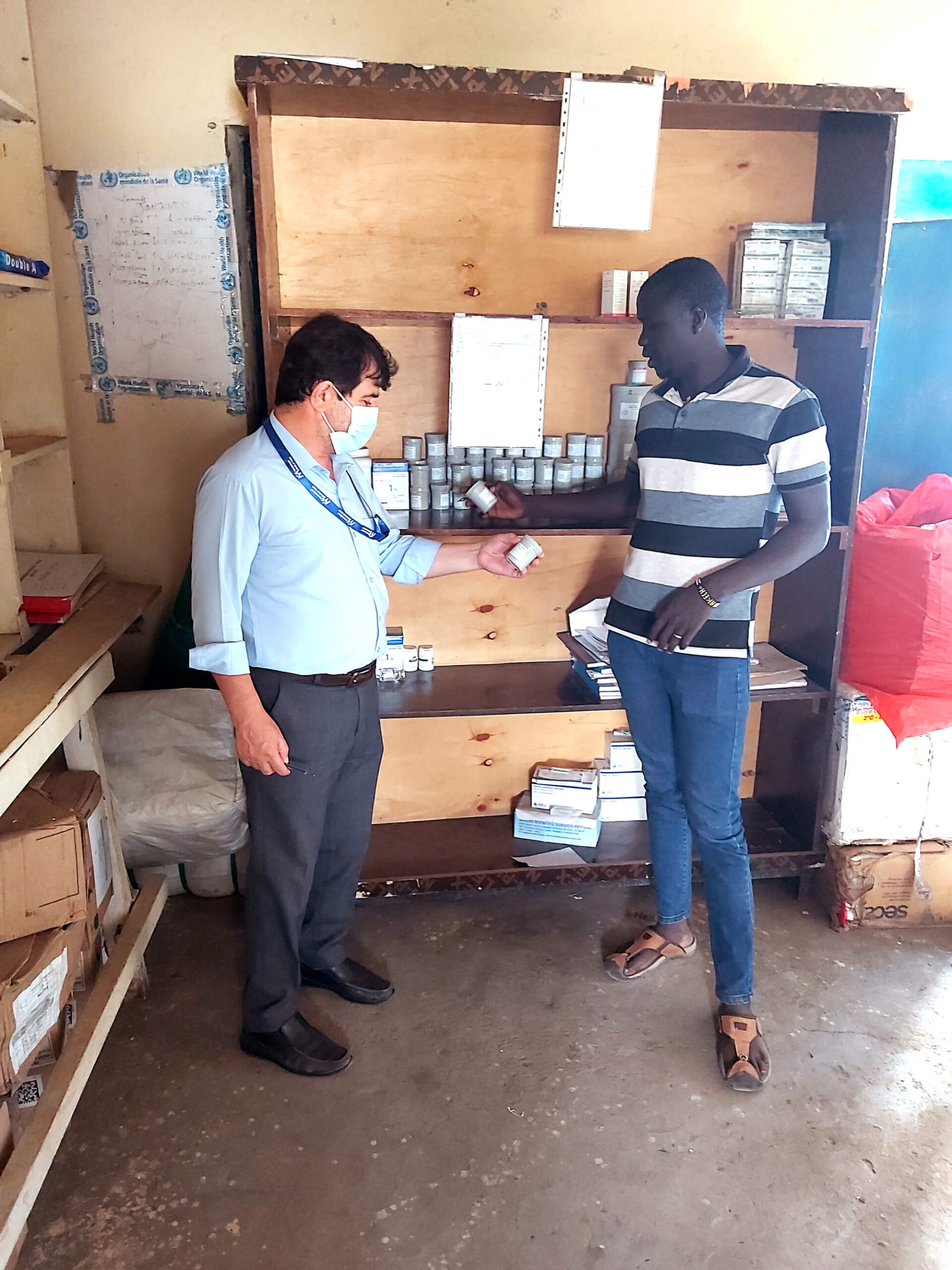 Dr. Ebadullah Hedayat conducts a pharmacy assessment at a health facility in Panyikang County.