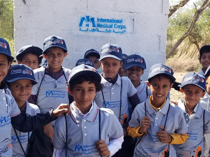 Excited children in Al Ahad village in a rural area of Ibb Governorate pose in front of a recently completed latrine—one of several built in Al Had and the neighboring village of Alkorshoob, communities that only a year ago had none.