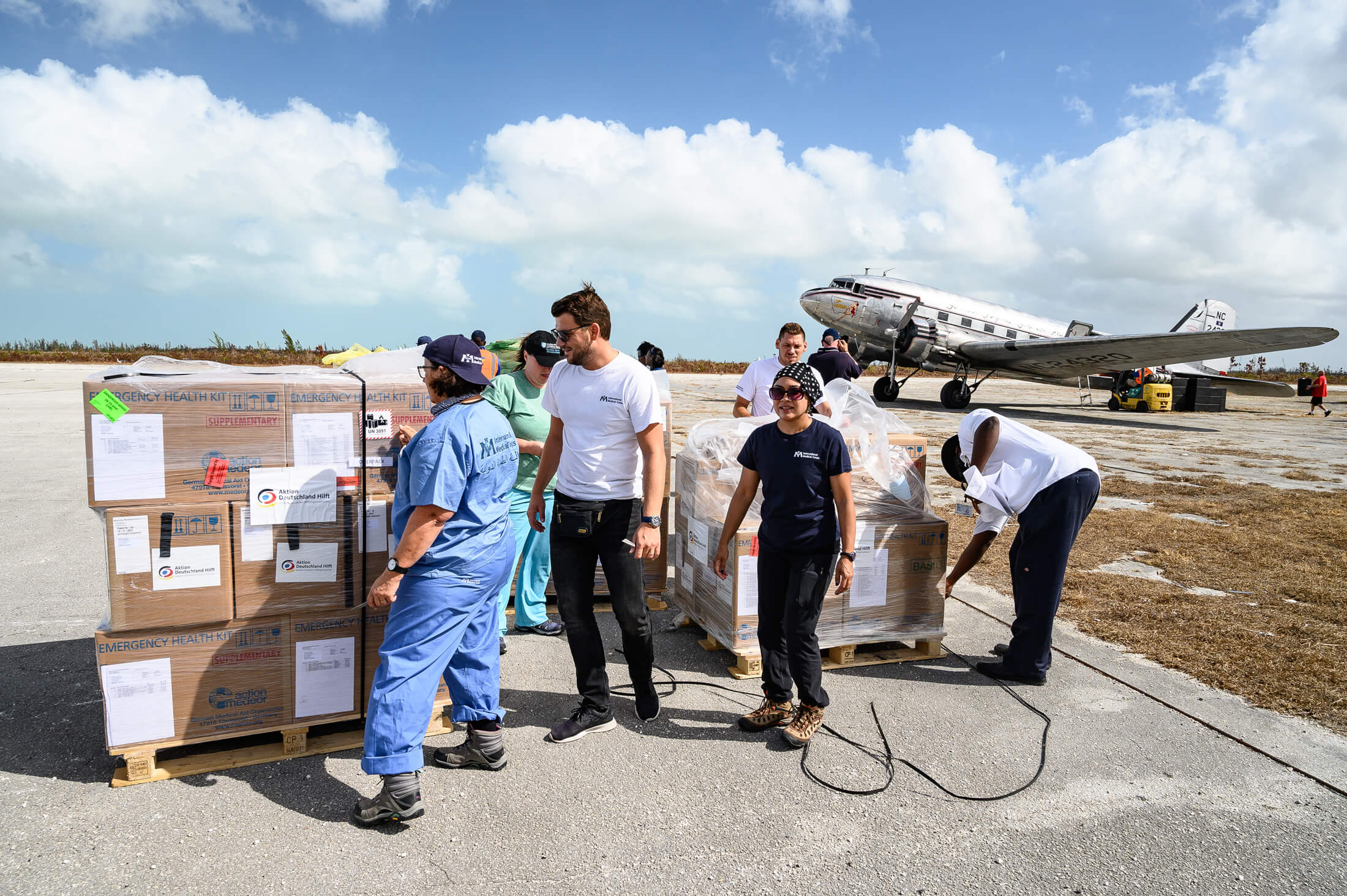 International Medical Corps Emergency Response Team members unload a shipment of emergency supplies in Freeport, Bahamas, in the wake of 2019’s Hurricane Dorian. The shipments contained essential medicines, consumables and other equipment necessary to serve hurricane-stricken communities.