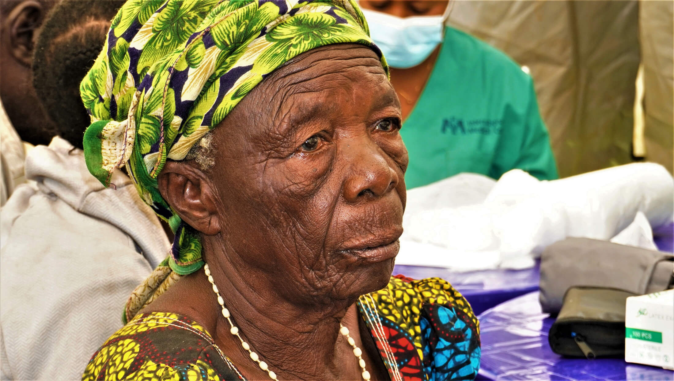 Patient Cecilia Twavuze waits for her consultation at the Minova mobile medical clinic.