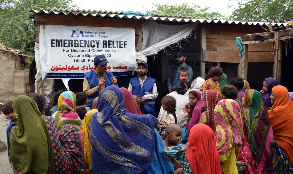 International Medical Corps staff conduct disease-awareness sessions for people relocated due to Cyclone BIparjoy.