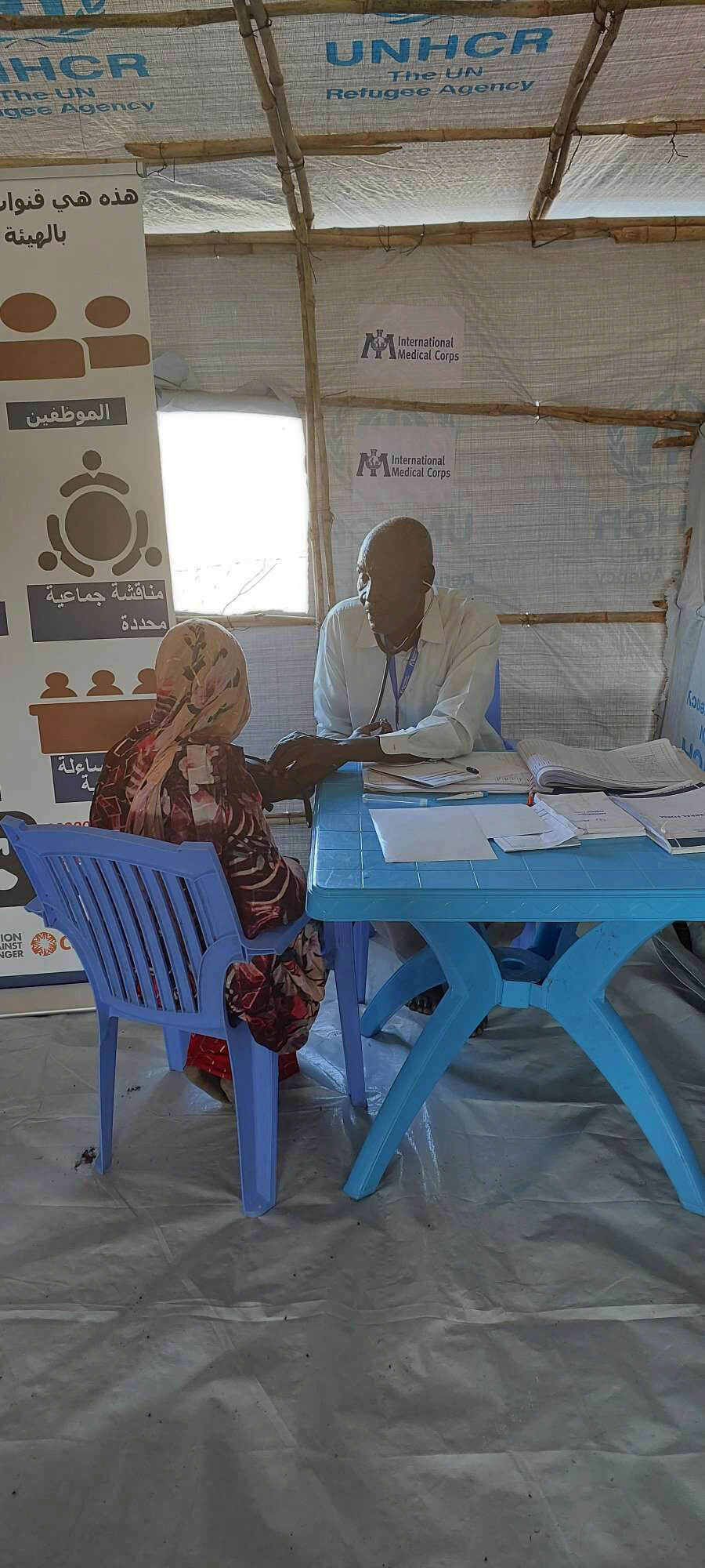 A clinical officer provides a health consultation for a displaced woman in Renk, South Sudan.