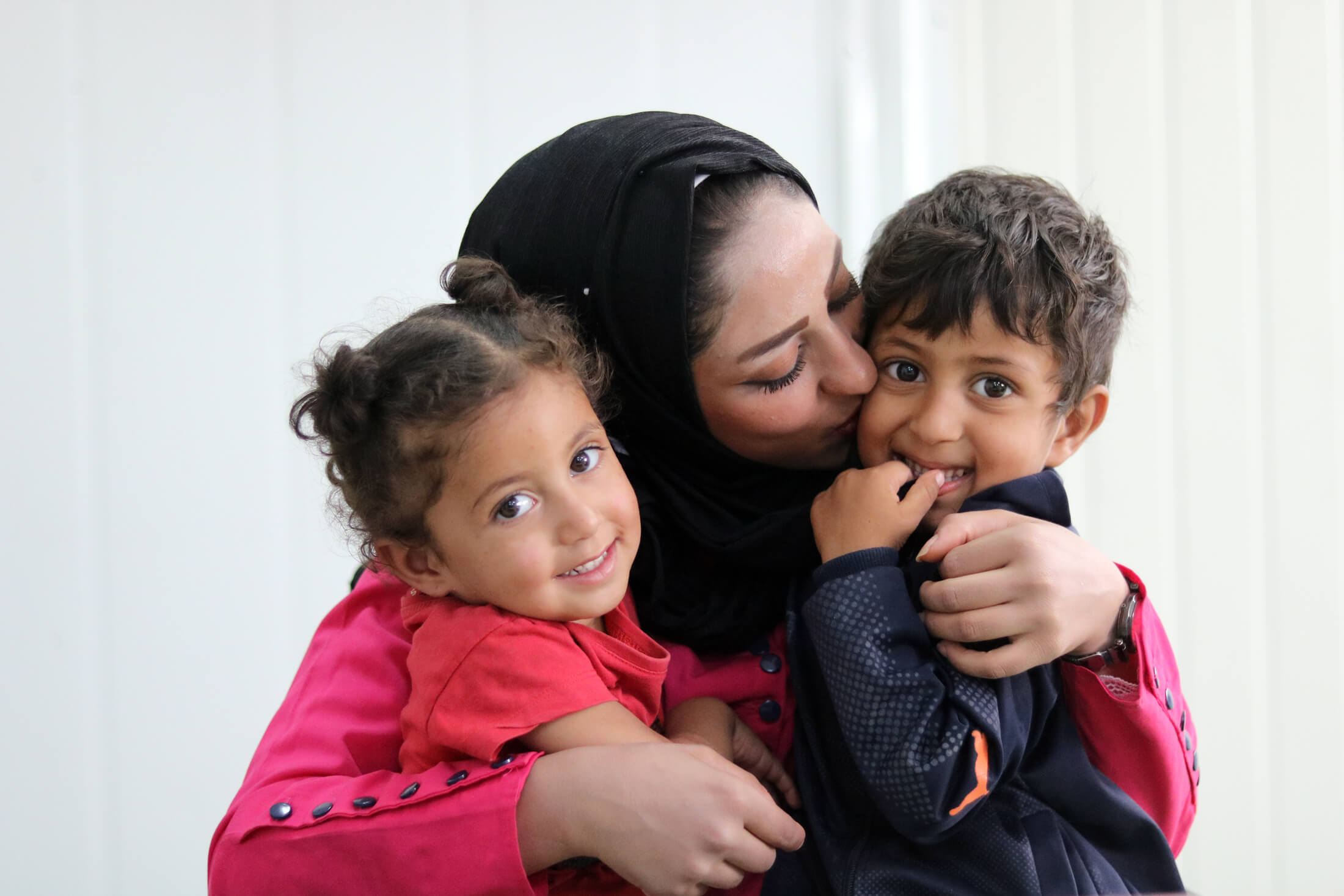 Alia, a Syrian refugee with her children.