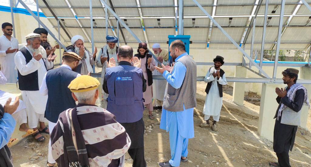 Community members and International Medical Corps staff get together to celebrate the new water project in Laghman province, in eastern Afghanistan.
