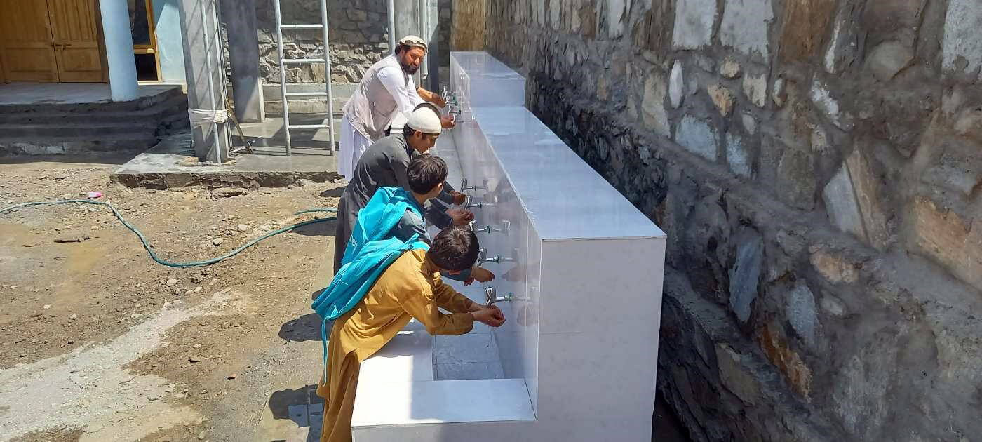Students at Muslimabad School practice handwashing, after learning about its importance.
