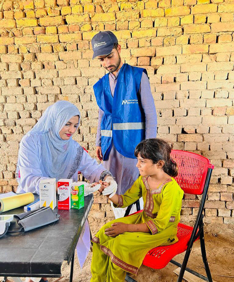 Dr. Nimra Sheikh treats a young patient.