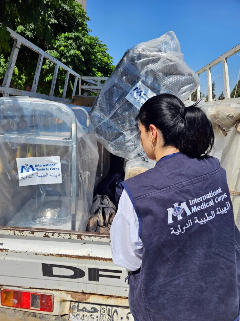 An International Medical Corps staff member prepares medical equipment for delivery to clinics in Hama governorate, Syria.