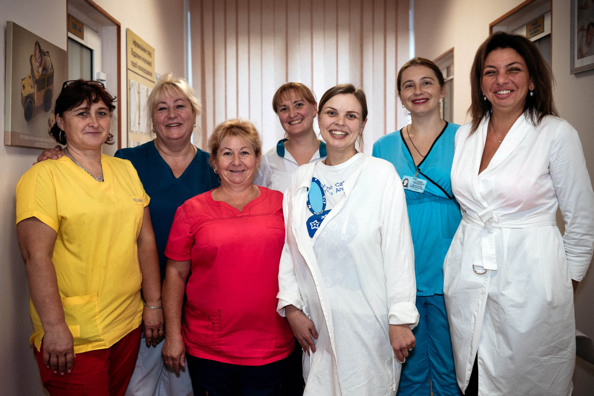 Iryna stands with staff who helped deliver her triplets at Maternity Hospital No. 5.