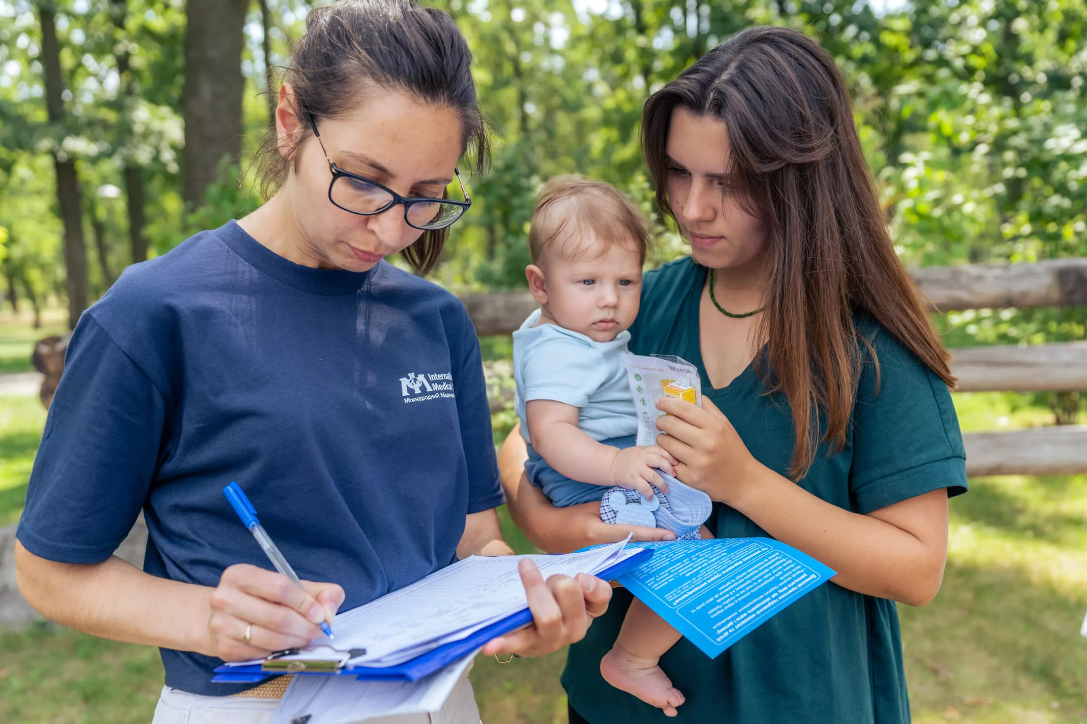 International Medical Corps staff members in Ukraine conduct lectures, gather information and hand out materials at an event for young parents and parents-to-be.