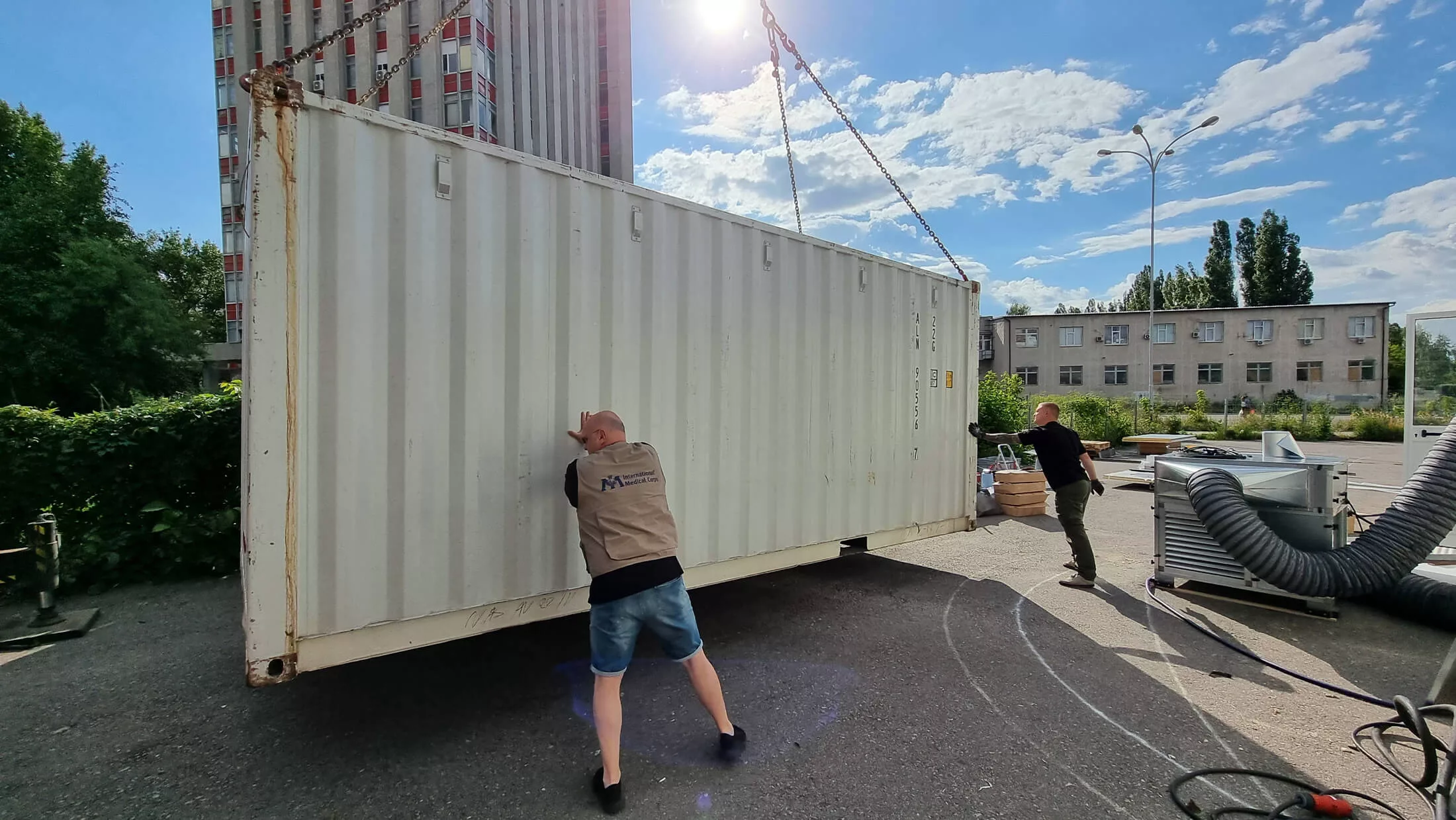 Marin Thomas helps to position one of the Hospitainer modules that make up the primary healthcare center that we set up and support in Kharkiv, Ukraine.