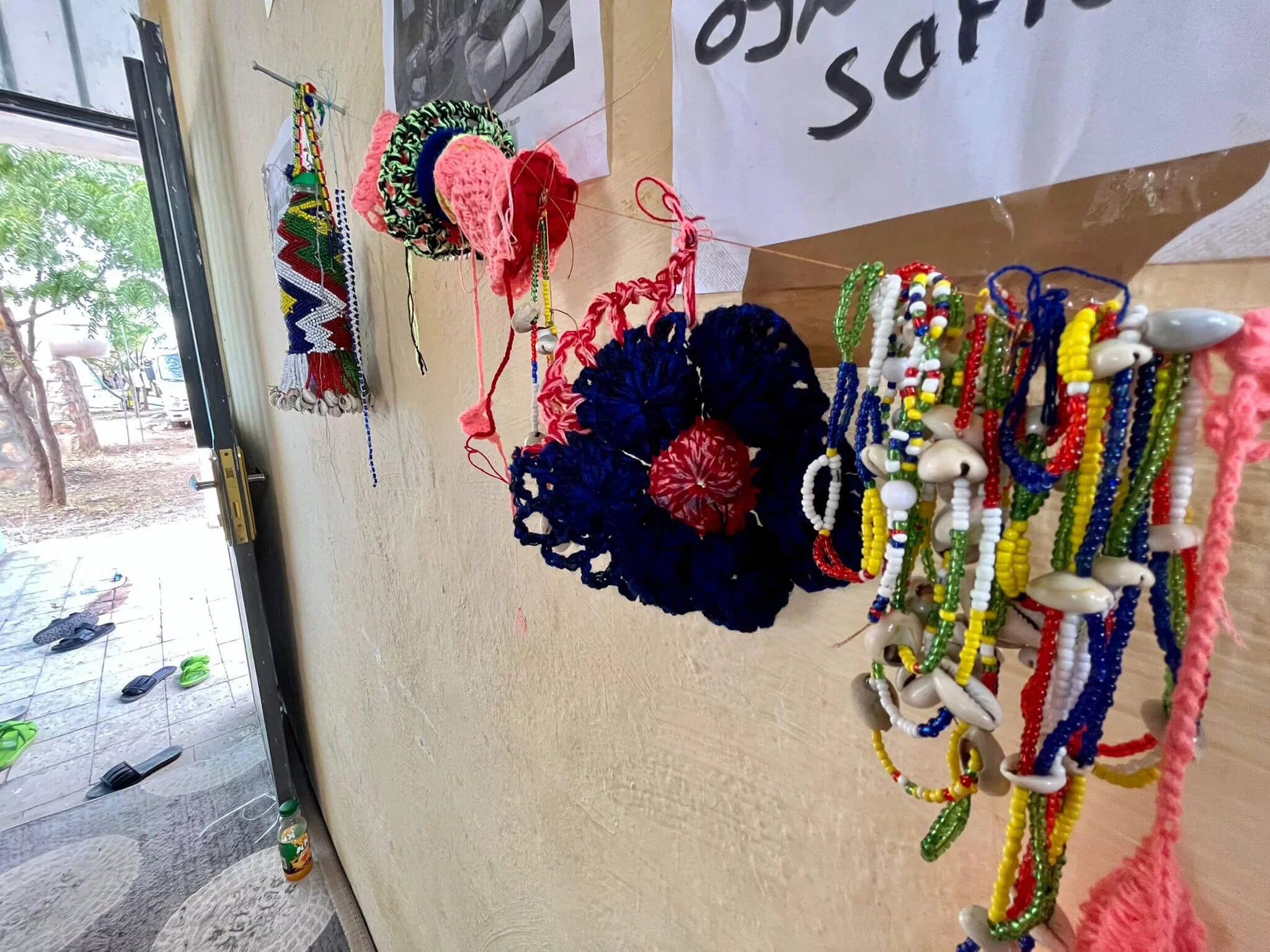 Handmade crafts hang on the walls of the safe space.