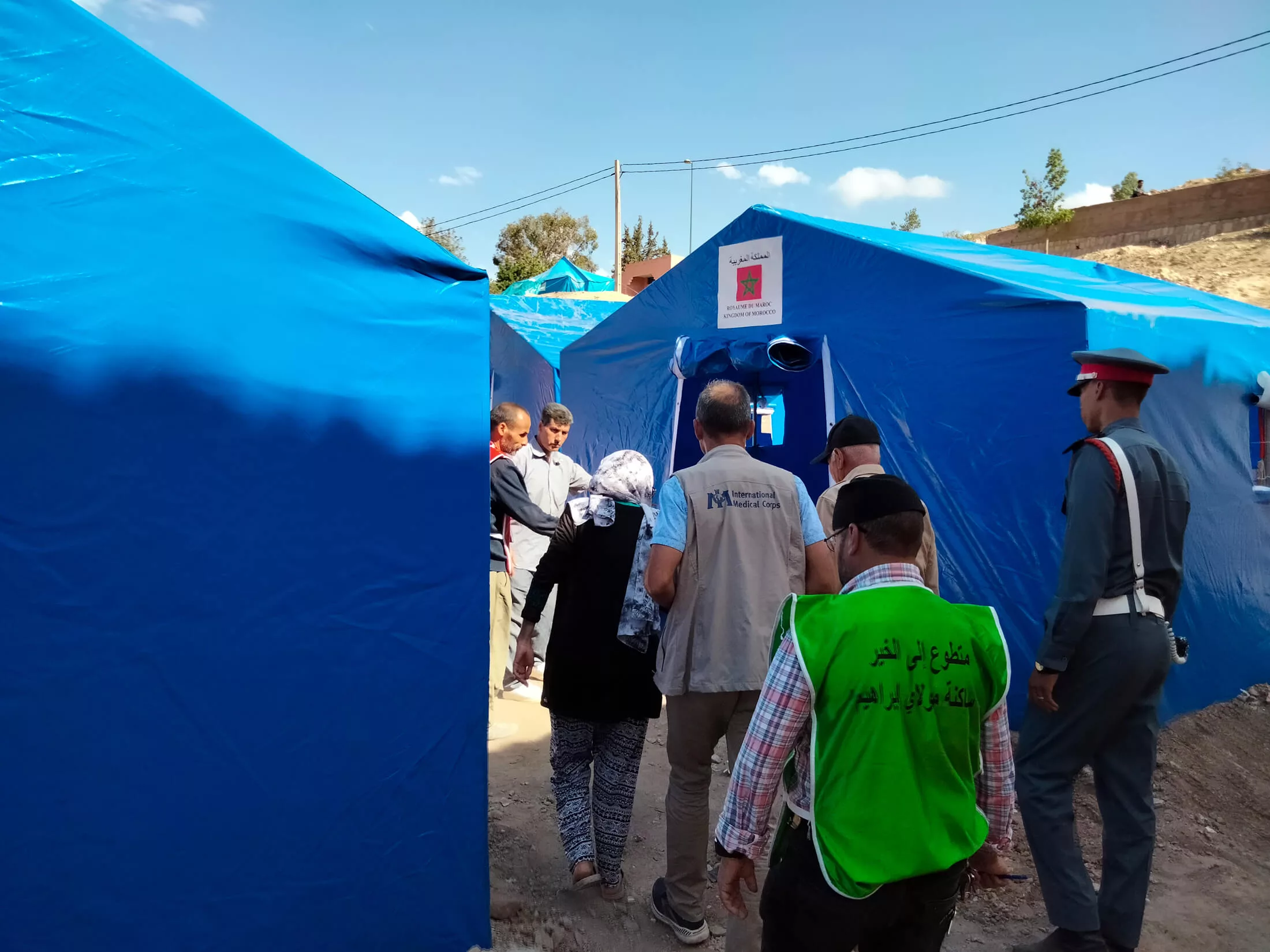 International Medical Corps staff provide support at a civil society tented camp set up for families affected by the earthquakes.